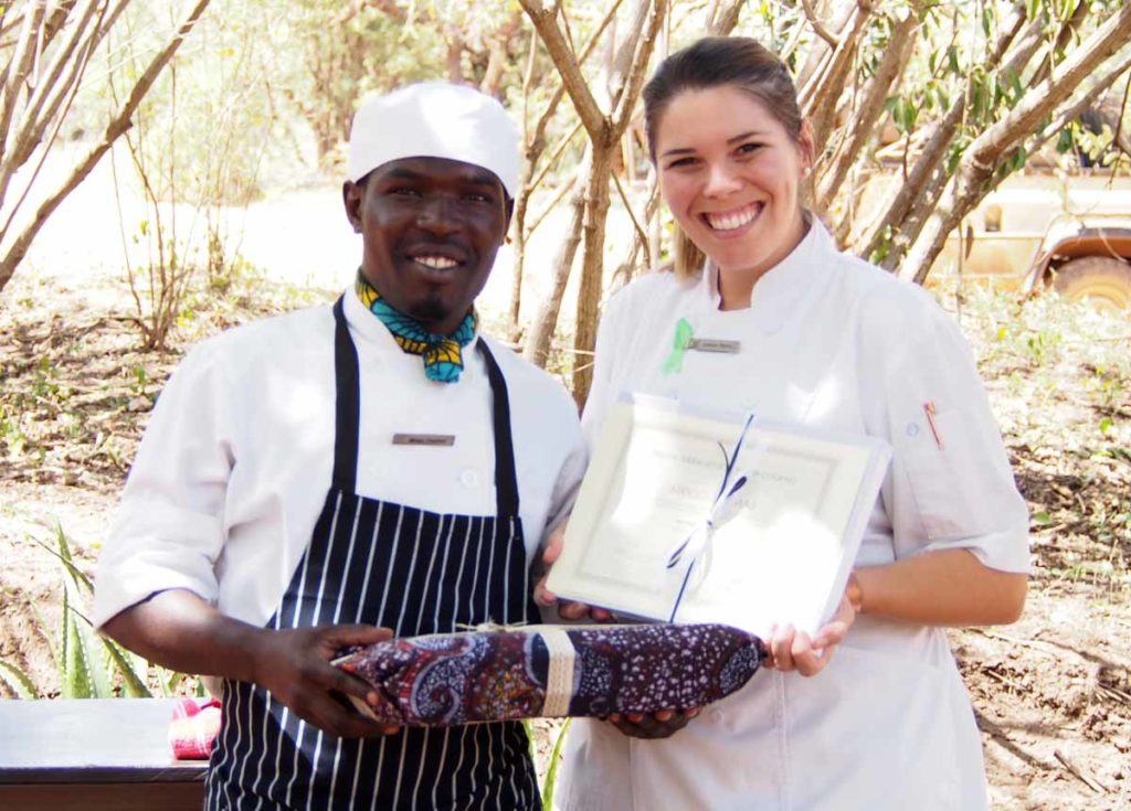 Mrigo Thomas getting his certificate from Singita pastry chef, Louise Heyns