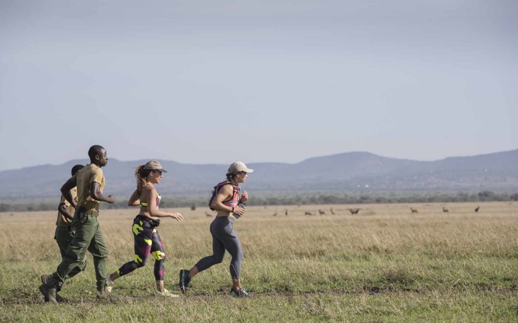 Marietta makes her way across the Serengeti on foot, accompanied by an armed anti-poaching scout from the Grumeti Fund who was on the lookout for overly curious wildlife!